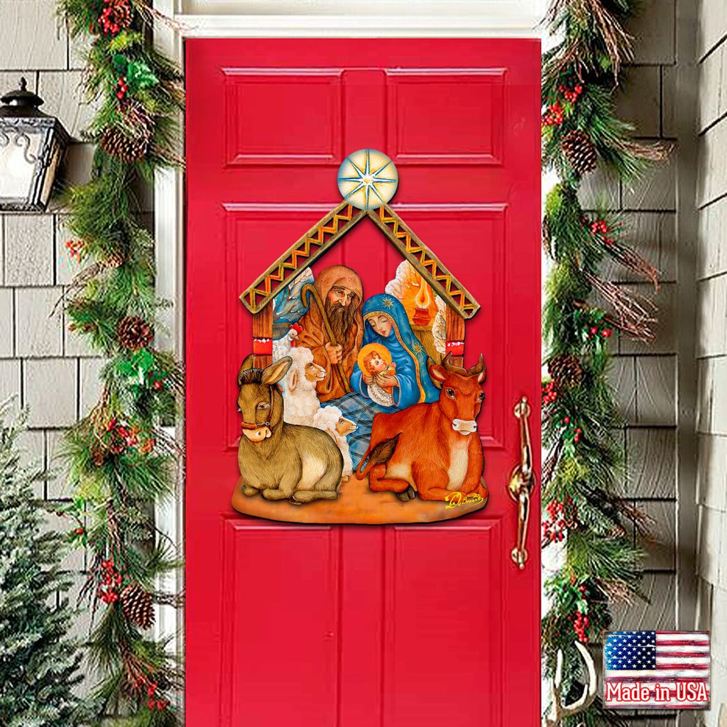 Nativity wooden door decor with manger scene, Mary and Joseph, animals, and star topper