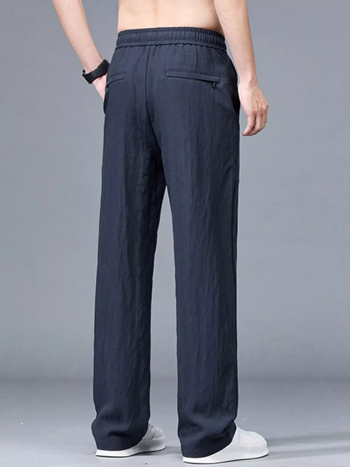 Lightweight casual pants in dark navy blue with elastic waistband, drawstring, and side pockets