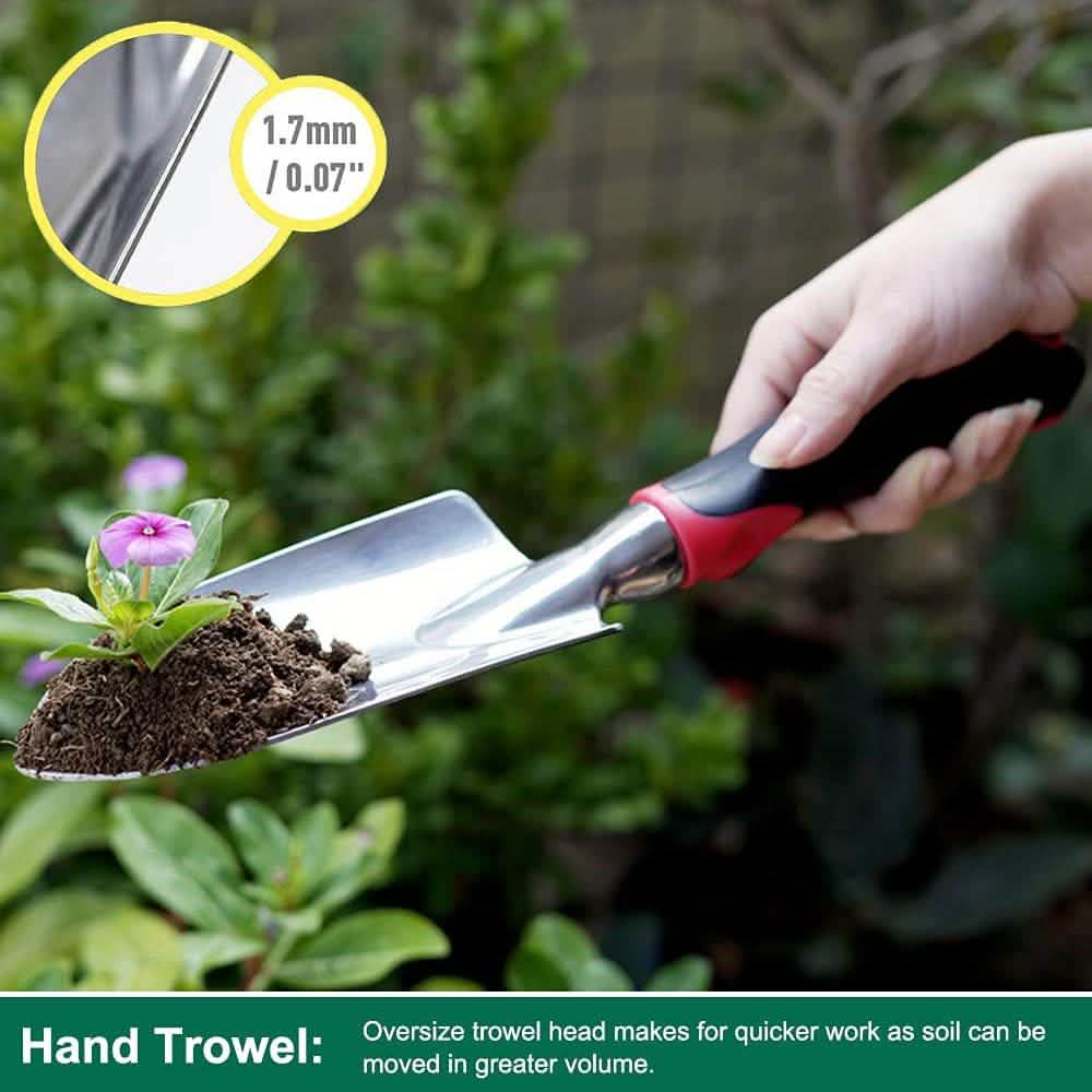 Hand trowel with metal blade and black/red handle in garden soil
