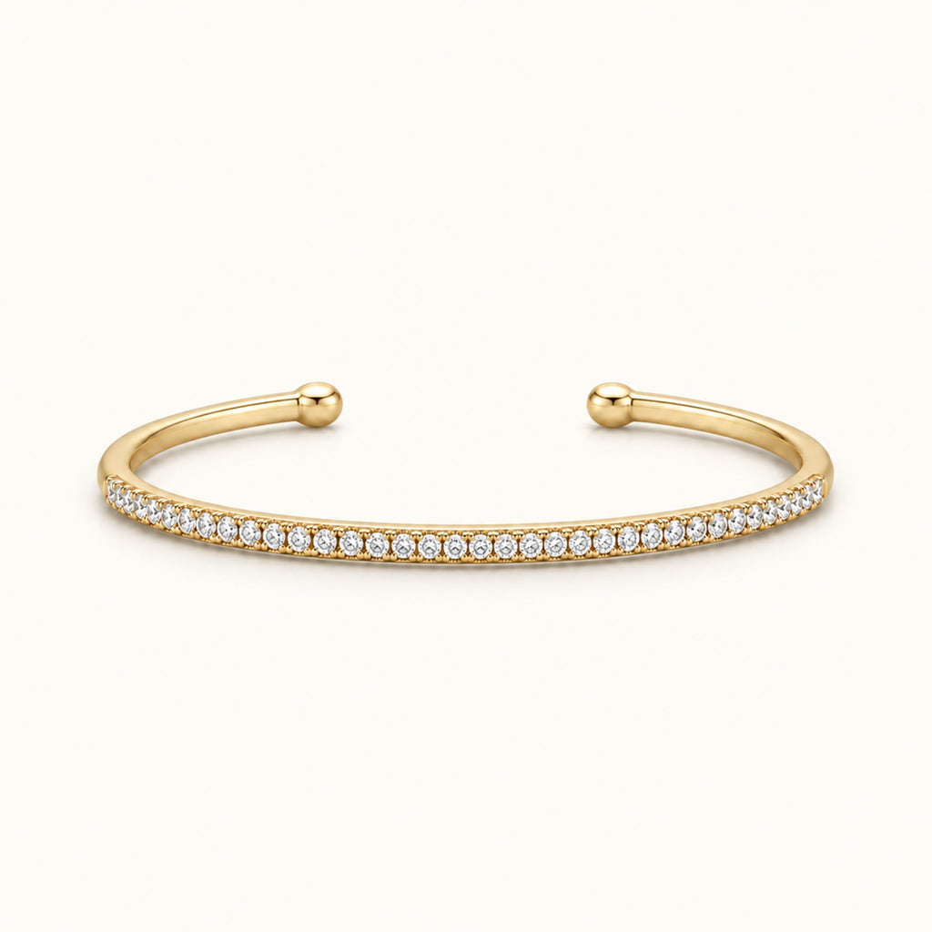 Thin gold-tone pave cuff bracelet with small round stones, hinged open ends