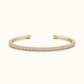 Thin gold-tone pave cuff bracelet with small round stones, hinged open ends