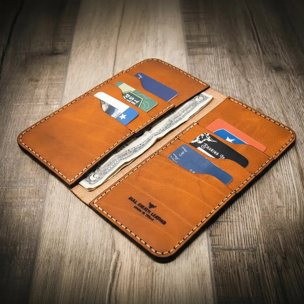 Orange-brown long leather wallet opened with card slots and bill compartment.
