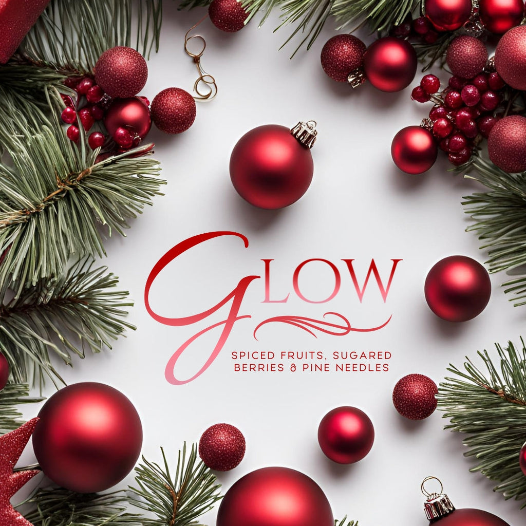 Glow candle label reading spiced fruits, sugared berries, and pine needles