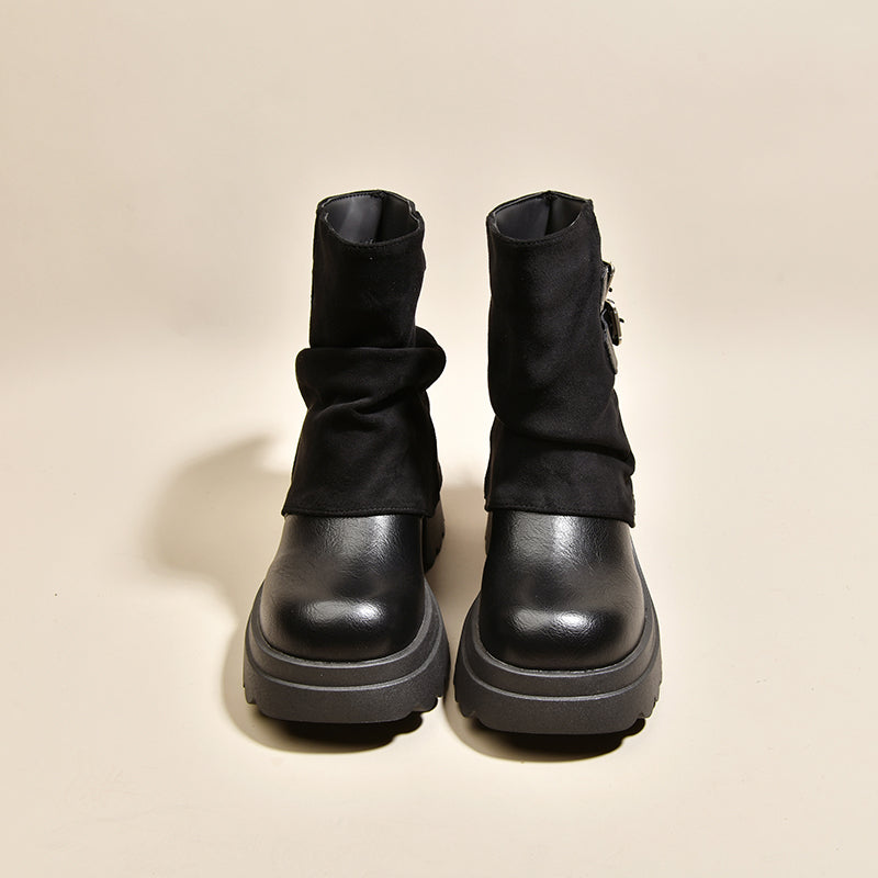 Black slouchy platform combat ankle boots with thick lug sole and pull-on style.
