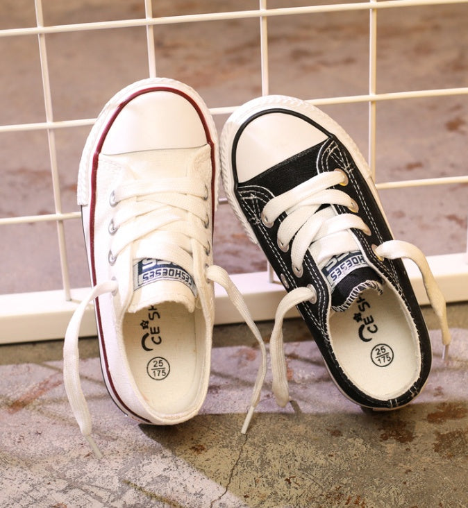 White/red and black lace-up canvas sneakers with rubber sole and toe cap