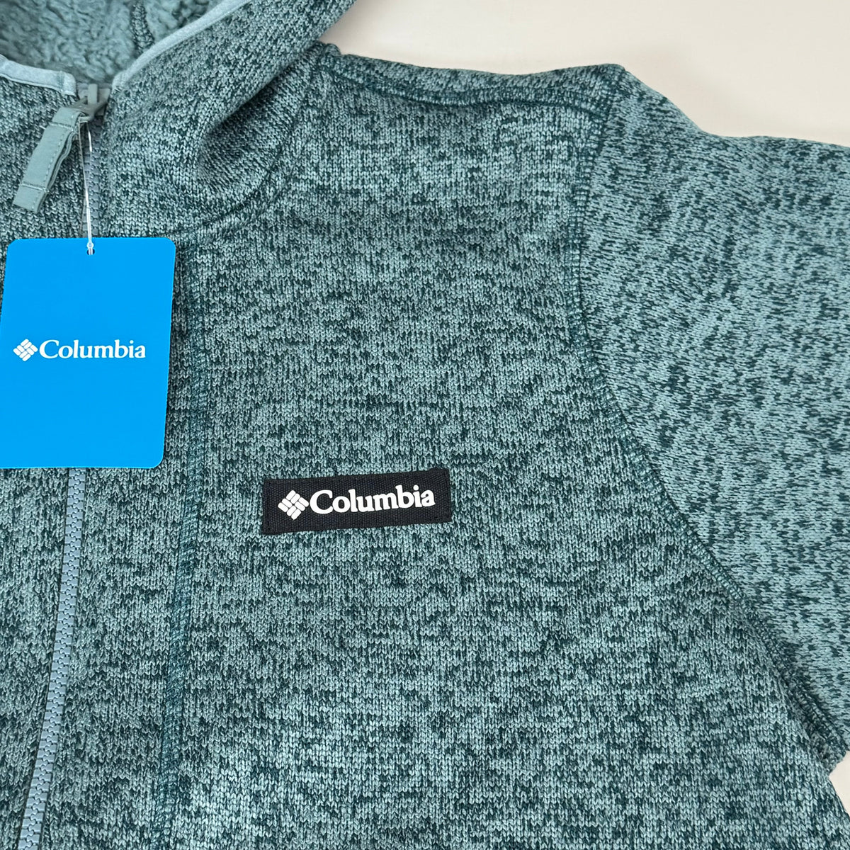 Men's heather teal fleece jacket with Columbia logo patches
