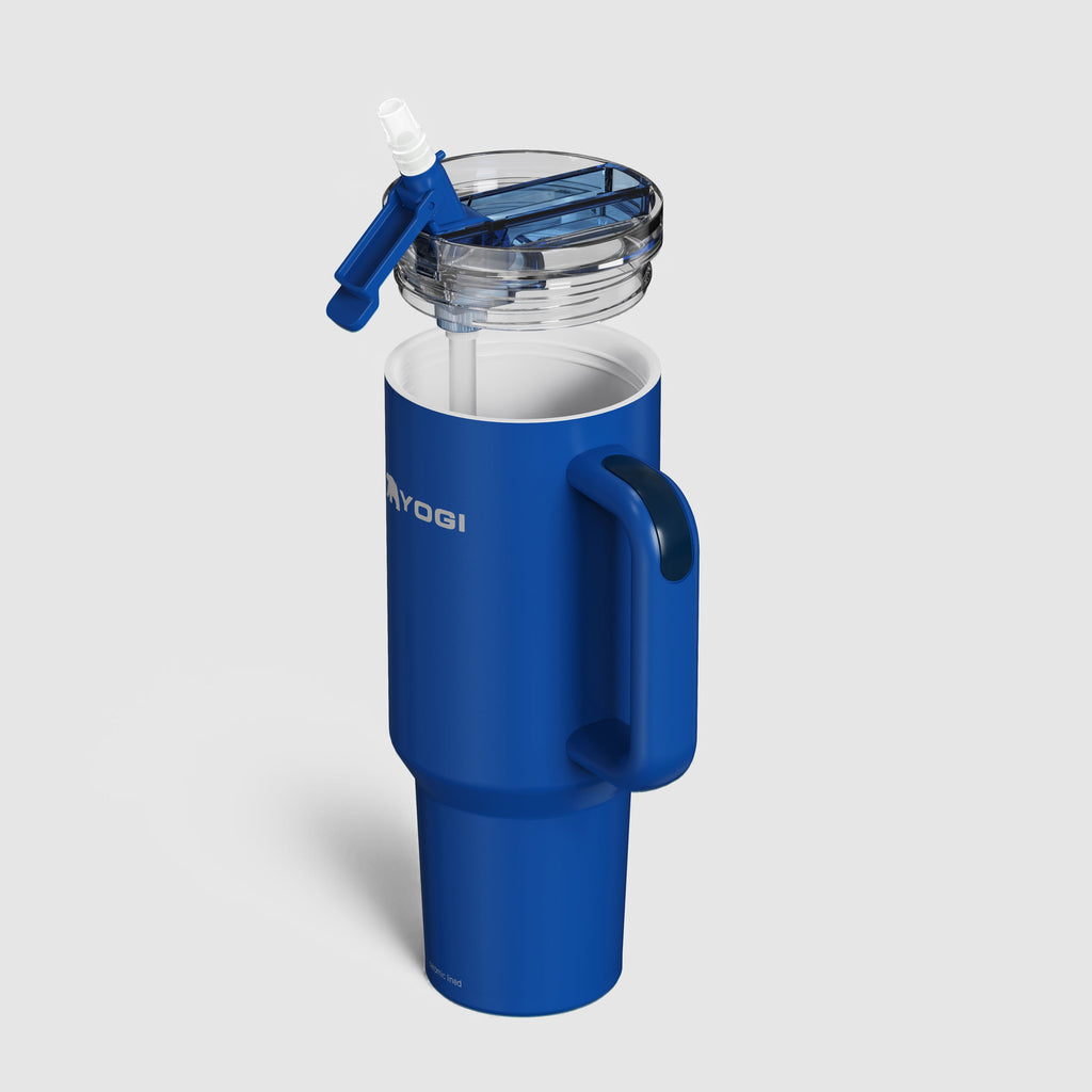 Blue ceramic-lined tumbler with open clear lid and handle; shows inner metal lining