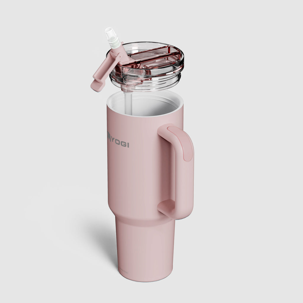 Ceramic-lined tumbler in light pink with clear flip-top lid and built-in handle