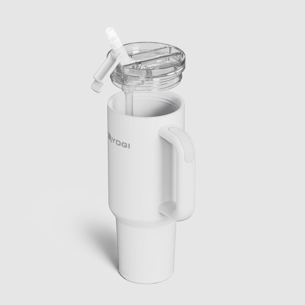White ceramic-lined Evolution tumbler with flip straw lid and side handle.