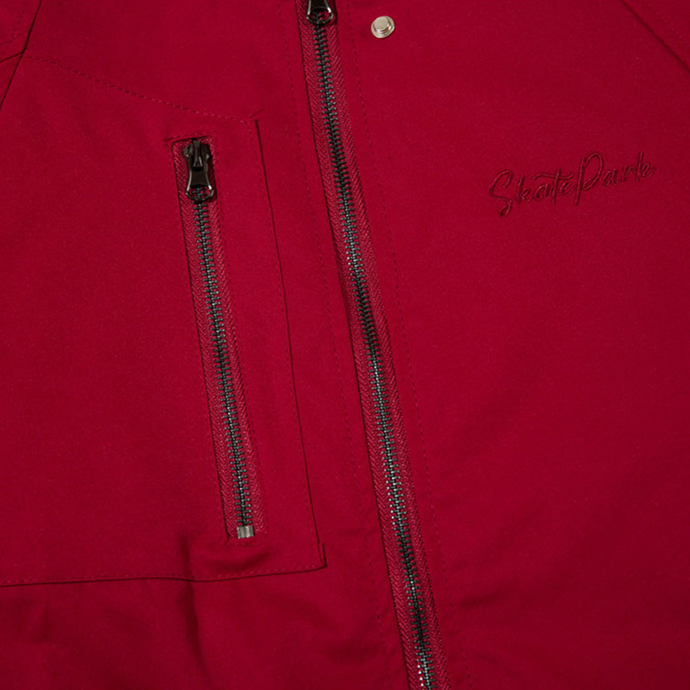 Red jacket coat close-up: two-way front zipper and small logo detail