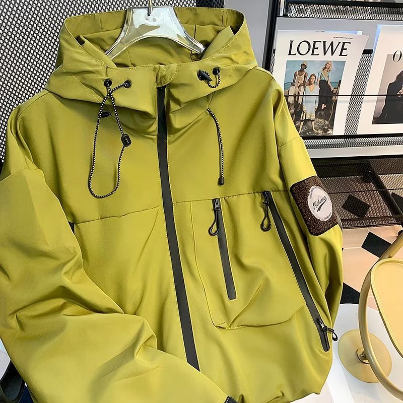 Green men's soft shell jacket with hooded zip front, drawcord details, front pockets