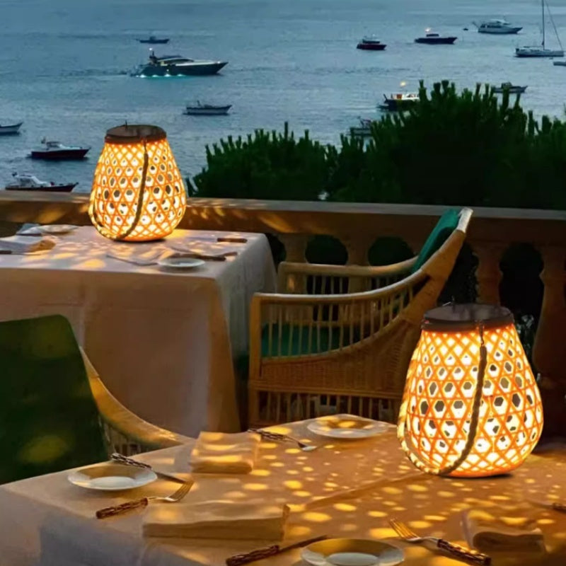 Hanging solar lantern with lattice bamboo-style shade, warm glowing light on table