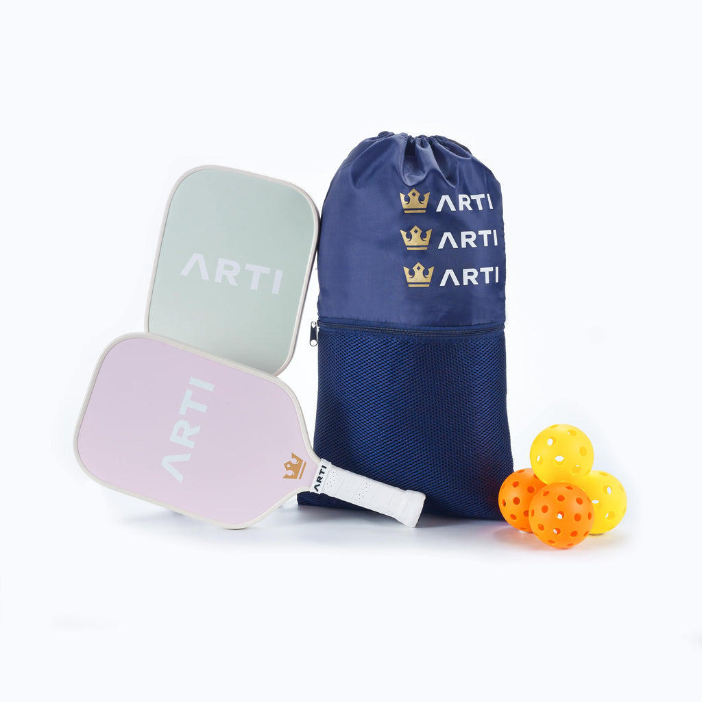Pickleball paddle set with 2 paddles, navy drawstring bag, and 3 training balls