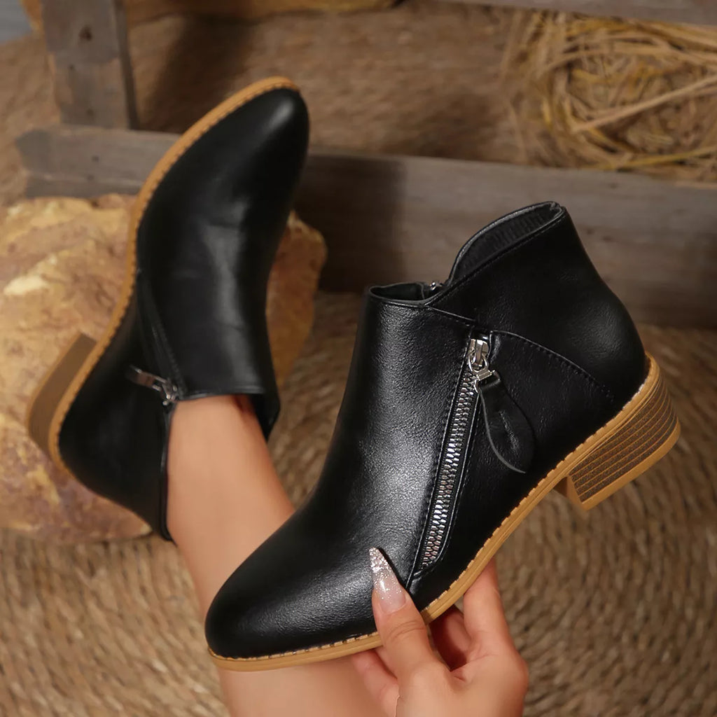 Black ankle boots with side zipper, stacked block heel, tan outsole
