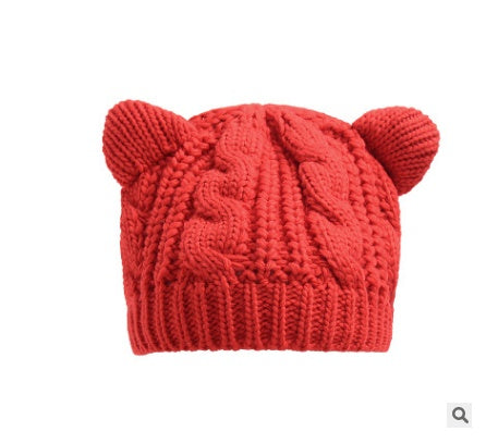 Red knit beanie hat with chunky cable knit and bear-ear design