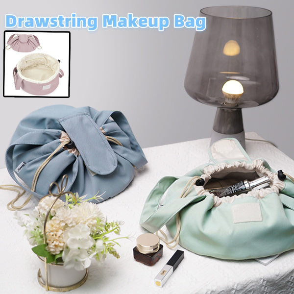 Large light blue barrel drawstring makeup bag with white drawstring cord