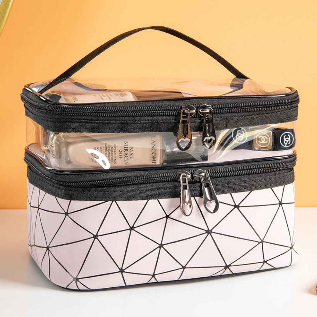 Closed double cosmetic bag with clear top, black zipper and white geometric pattern