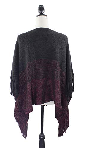 Knit batwing poncho with fringe trim, back view in dark charcoal and wine-red panel