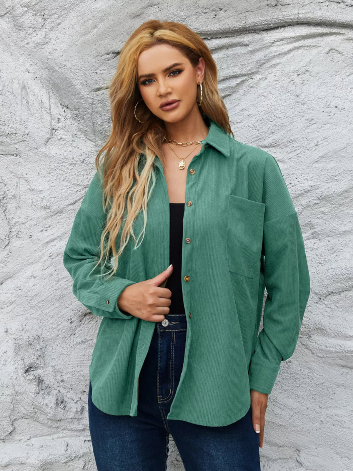 Teal-green corduroy button-up shirt with button front and a chest pocket