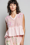 Pink V-neck sleeveless top with floral patch sleeves and ruffled peplum hem, raw edge