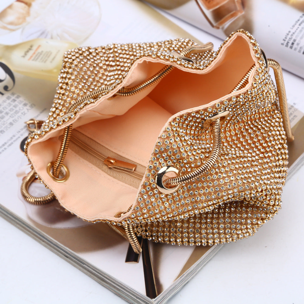 Gold crystal beaded crossbody bag open, showing satin lining and clasp