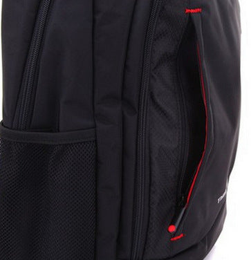 Black backpack side view with mesh pocket, zip compartments, and red trim