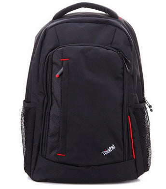 Black computer backpack with two front zippers, red accents, and top handle