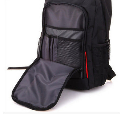 Black computer backpack with padded tablet sleeve opening and inner mesh pocket