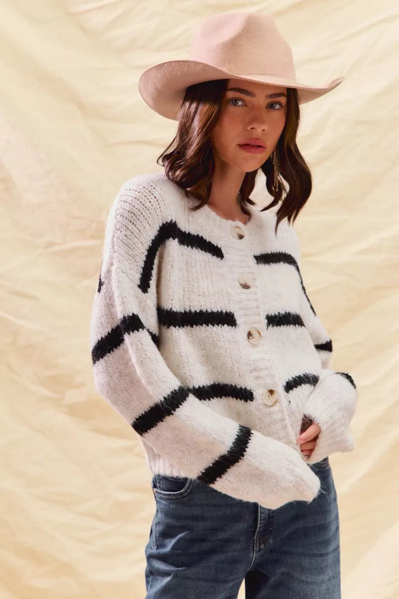 Striped button-front knit cardigan, cream base with black stripe bands and round buttons