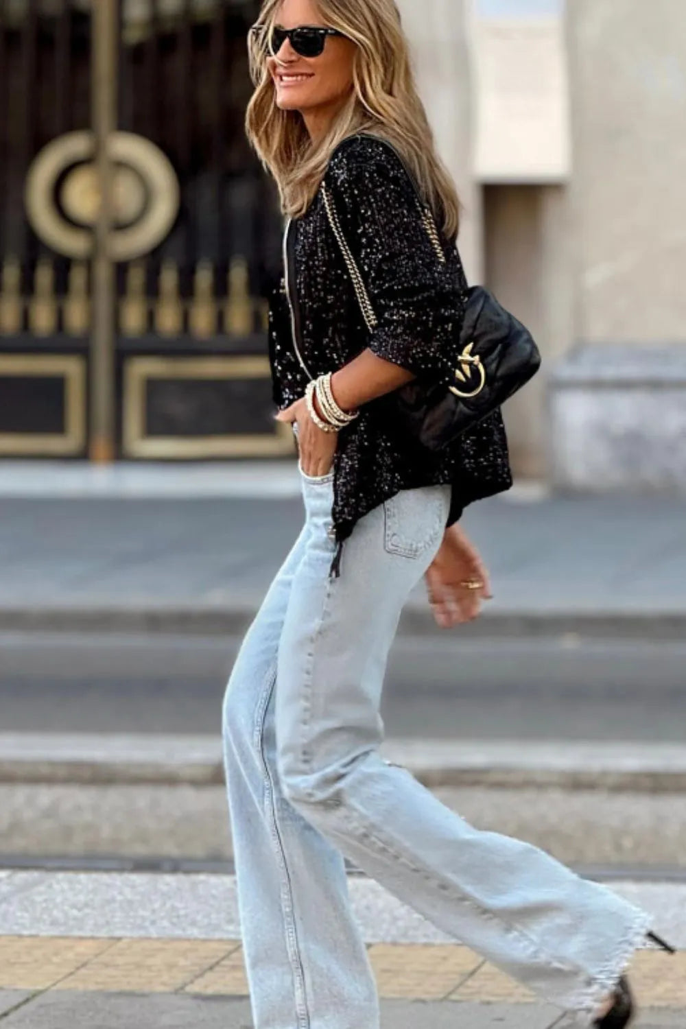 Black sequin zip-up long sleeve jacket with zipper front and gathered sleeve cuffs