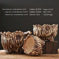 Two ceramic flower pots with tree-root design, one open side, brown speckled finish