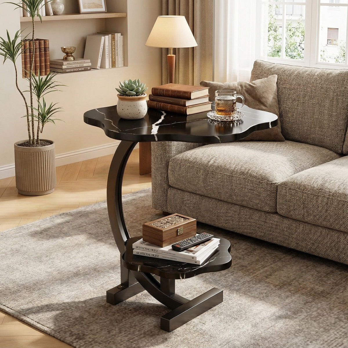 Black round side table with lower shelf and curved metal supports.