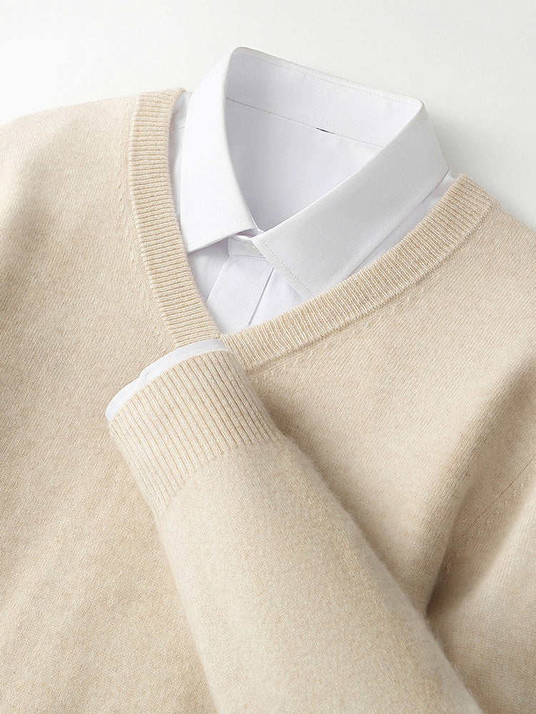Beige V-neck cashmere sweater close-up with ribbed trim and long sleeves