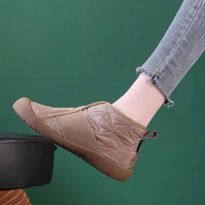 Taupe quilted ankle snow boots with faux-fur collar, side zip, and flat rubber sole