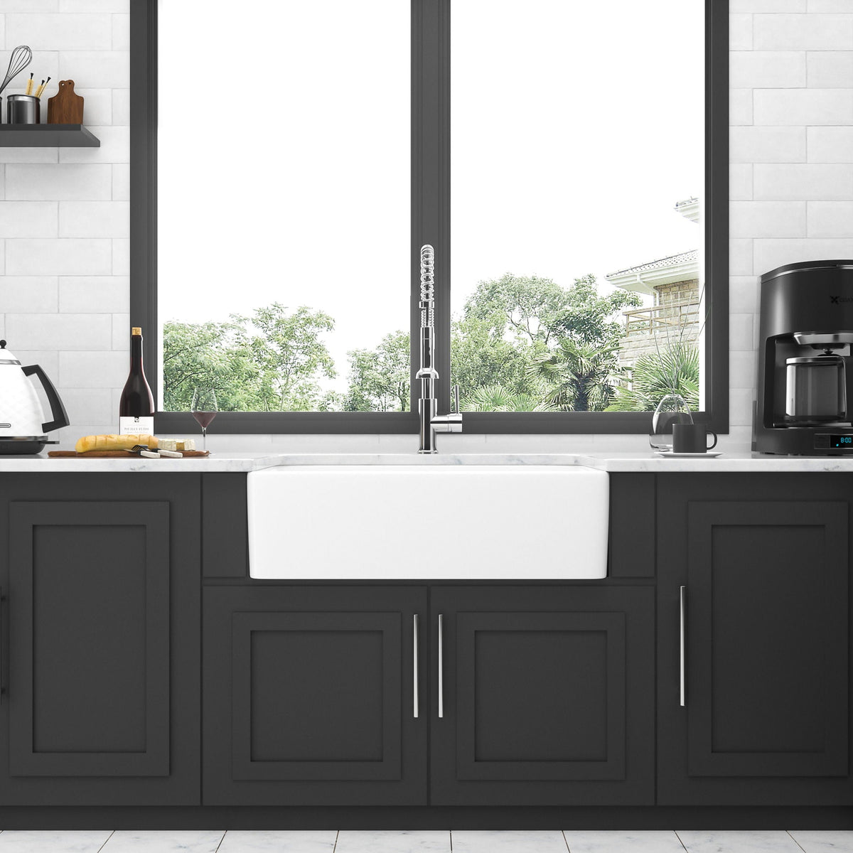 White ceramic single-bowl farmhouse apron front sink with rectangular basin and drain hole