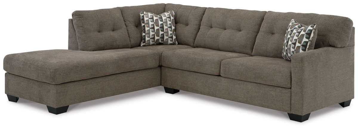 Dark gray sectional sofa with corner chaise and patterned throw pillows