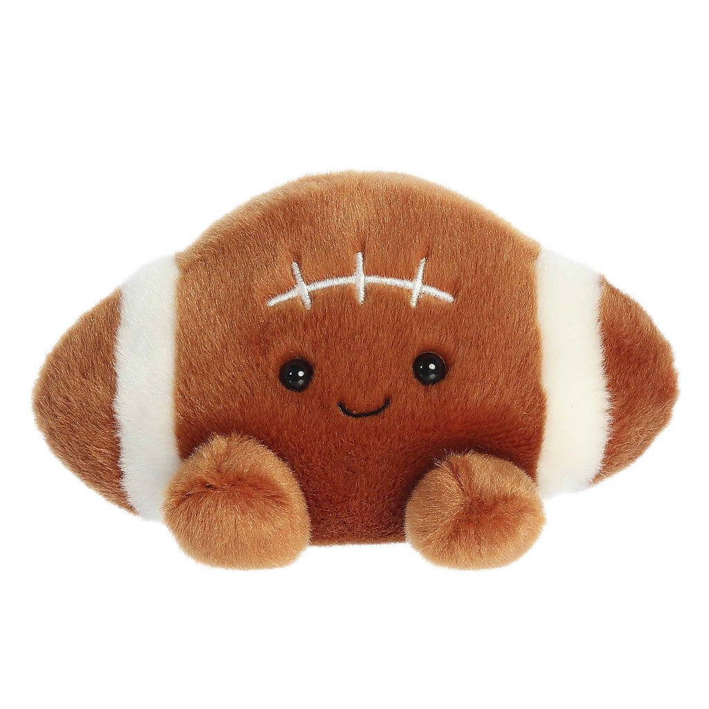 Football-shaped plush palm pal with smiling face, dark eyes, and white stitches