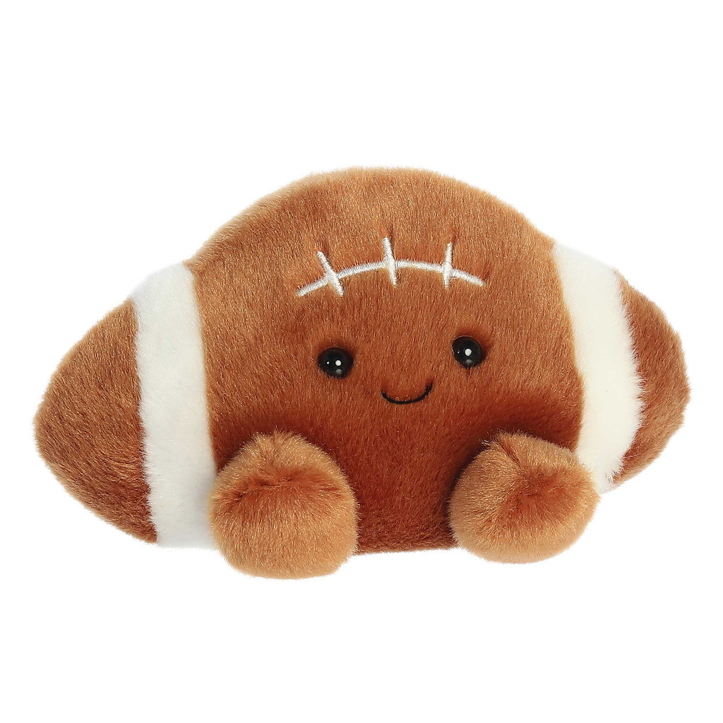 Football-shaped plush palm pal with smiling face and white yard-line stitches