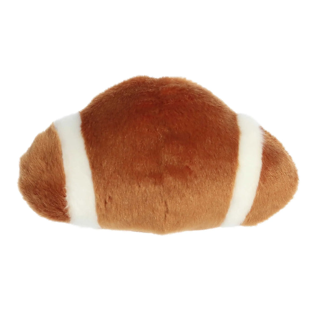 Back view football plush with white side stripes and rounded brown body