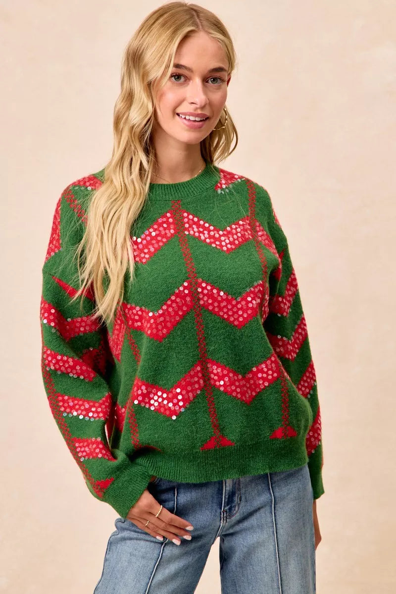 Green chevron knit sweater with red sequin zigzag pattern and long sleeves