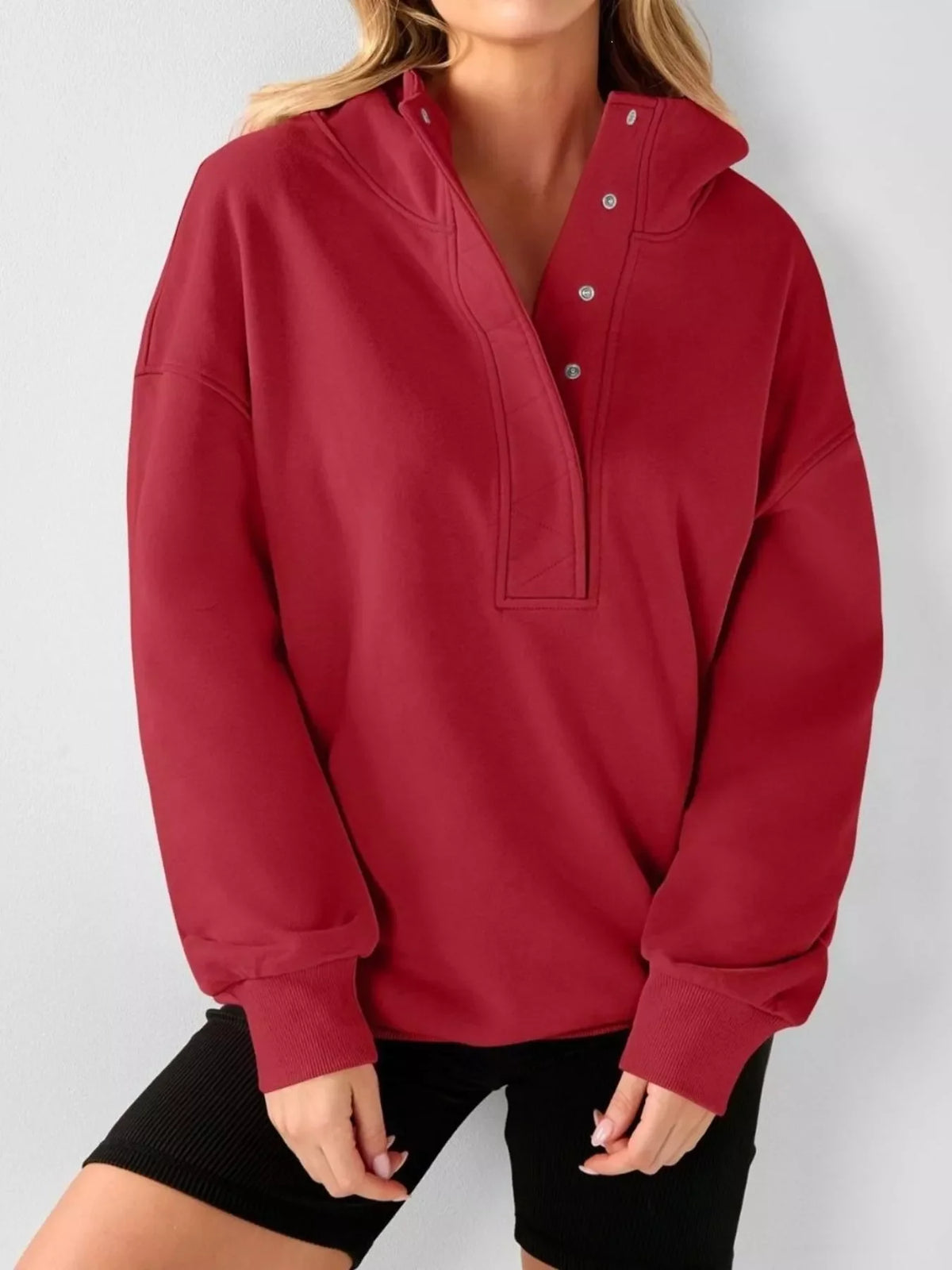 Red half-snap pullover hoodie with snap placket and hood