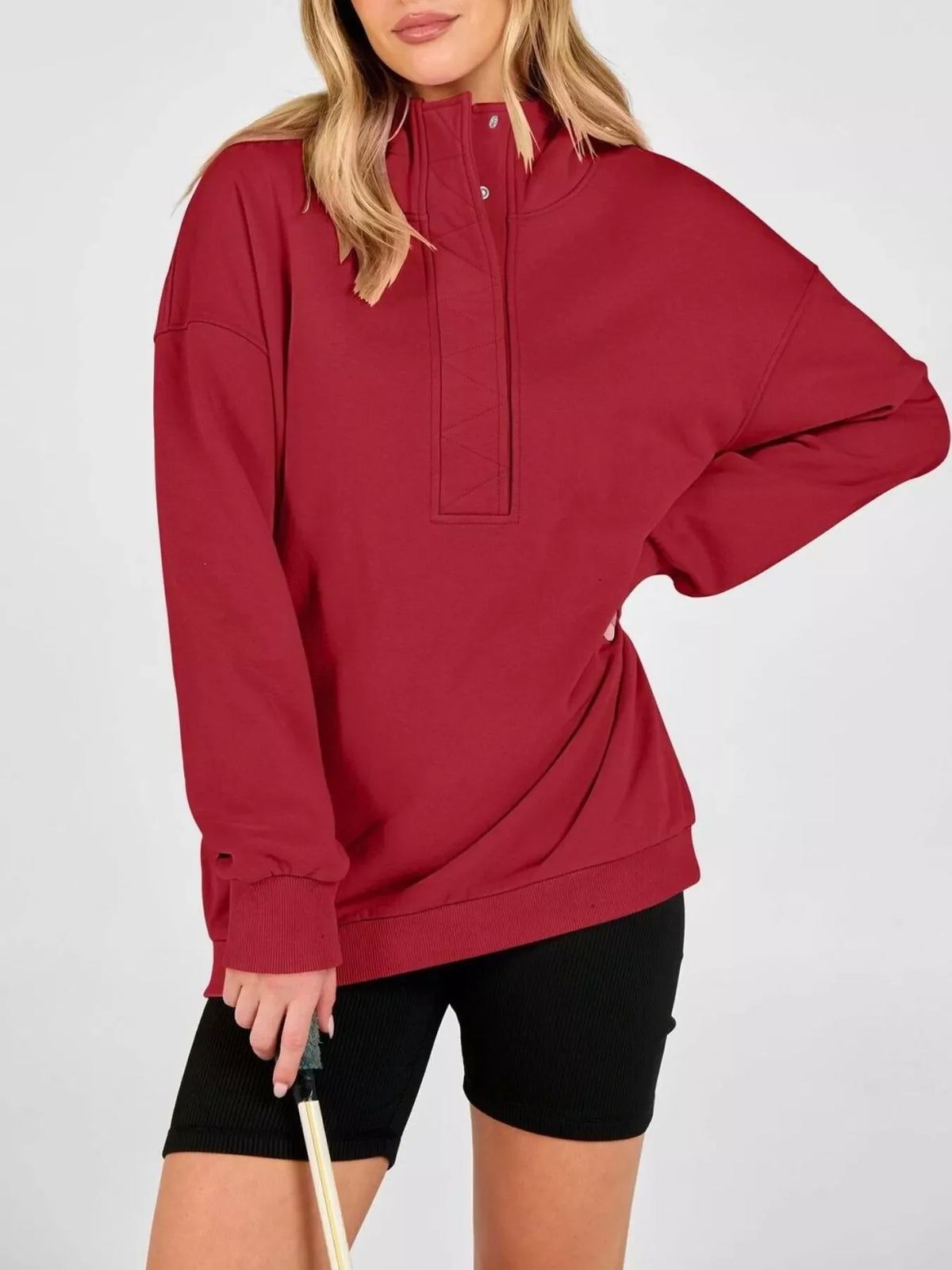 Red half-snap hoodie with drawstring hood and relaxed dropped shoulders