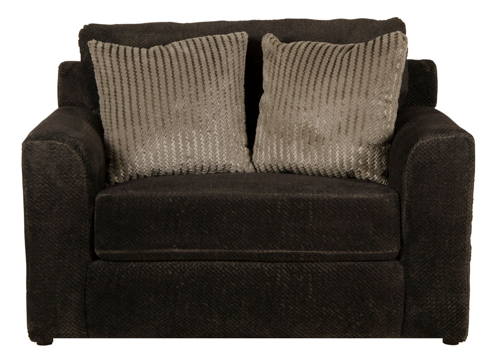 Dark brown upholstered armchair with two patterned pillows and textured upholstery