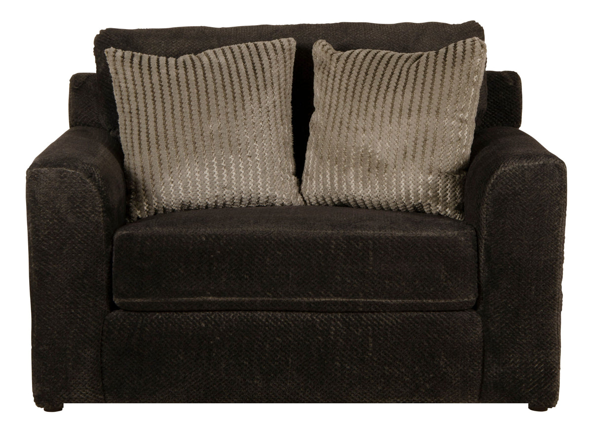Dark brown upholstered armchair with two patterned pillows and textured upholstery