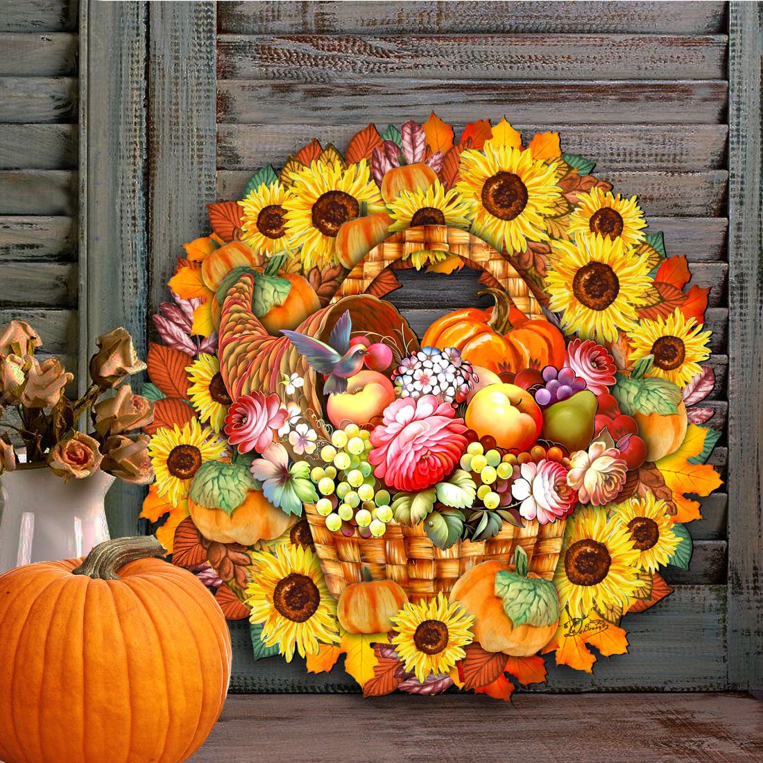Thanksgiving door wreath featuring sunflowers, pumpkins, grapes, and colorful autumn leaves