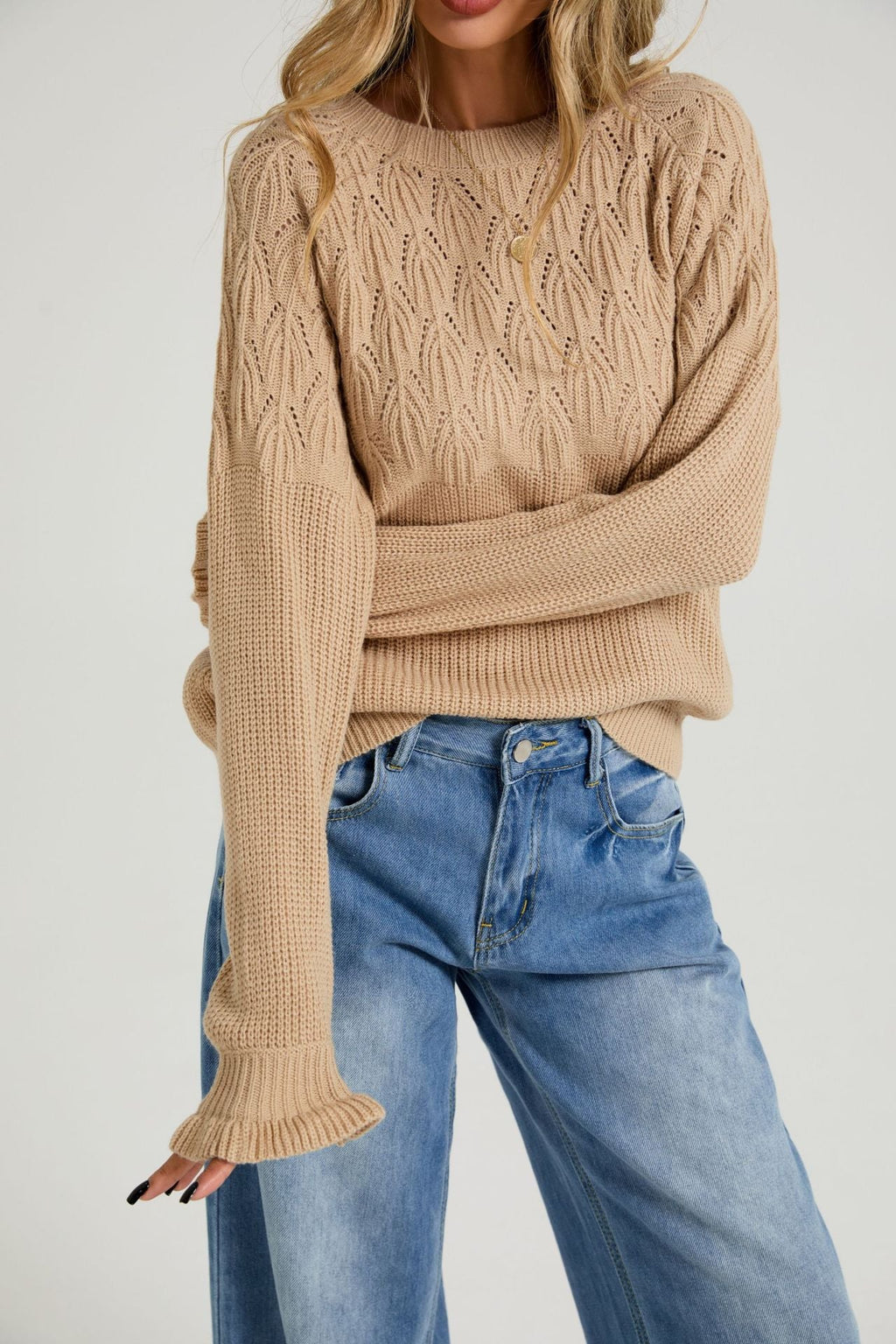 Beige womens crew-neck sweater with textured knit pattern and long bell sleeves