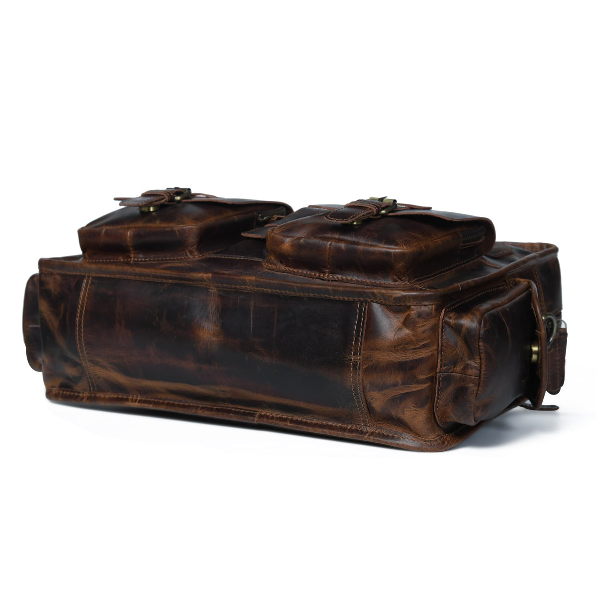 Dark brown leather briefcase side view with buckled handles, zipper, and metal hardware.