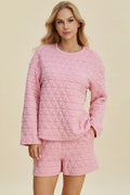 Pink textured long-sleeve top and matching shorts set with side tie detail