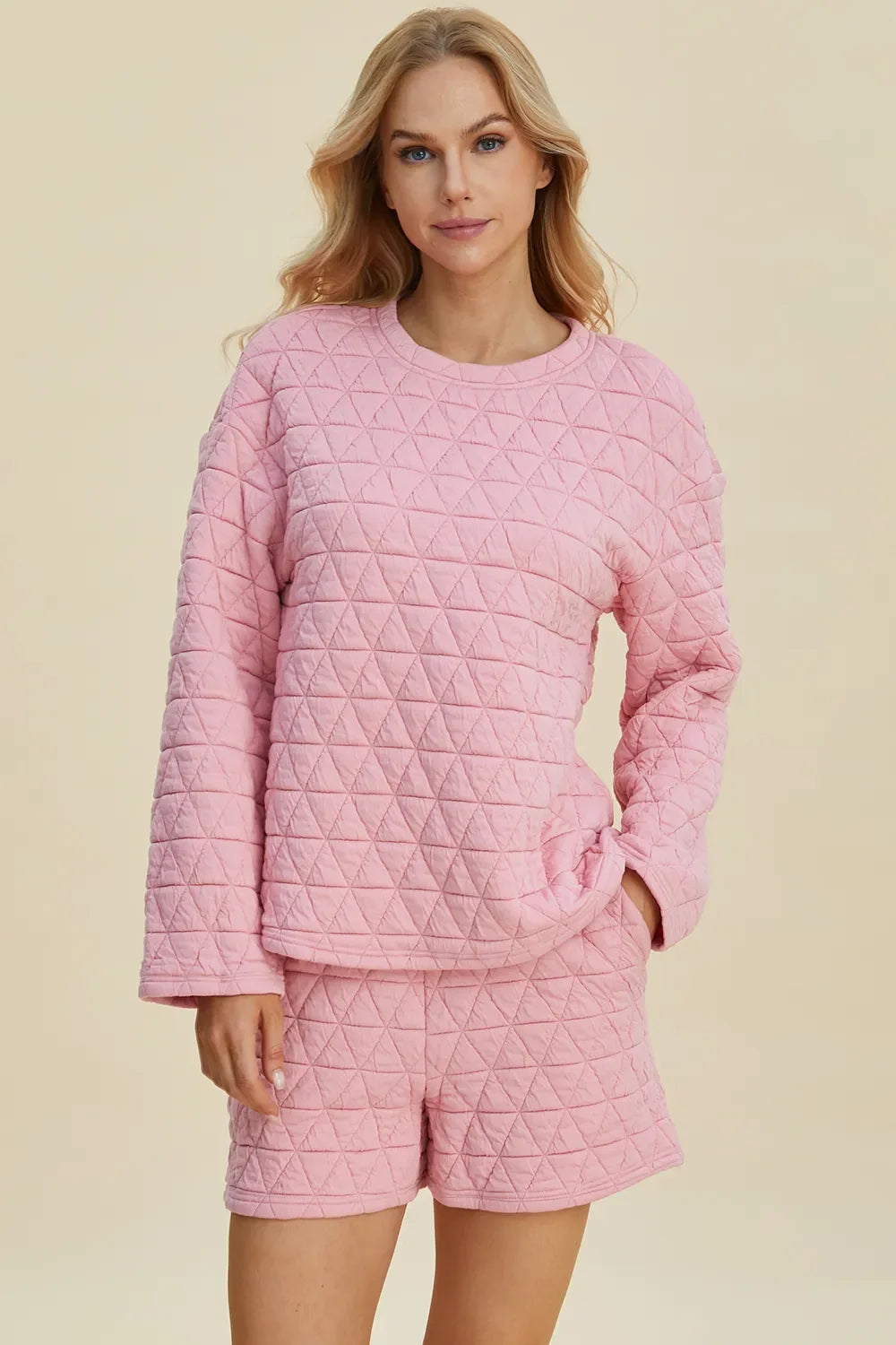 Pink textured long-sleeve top and matching shorts set with side tie detail