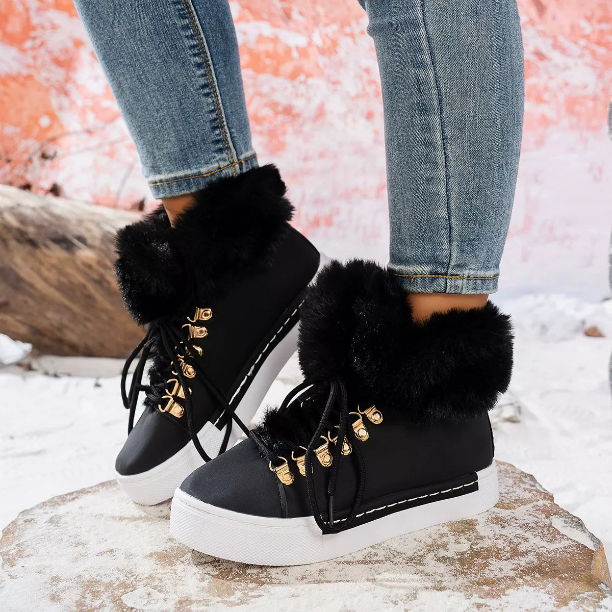 Black fuzzy-collar lace-up ankle boots with gold eyelets and white rubber sole